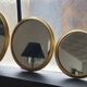 Suite of three brass mirrors