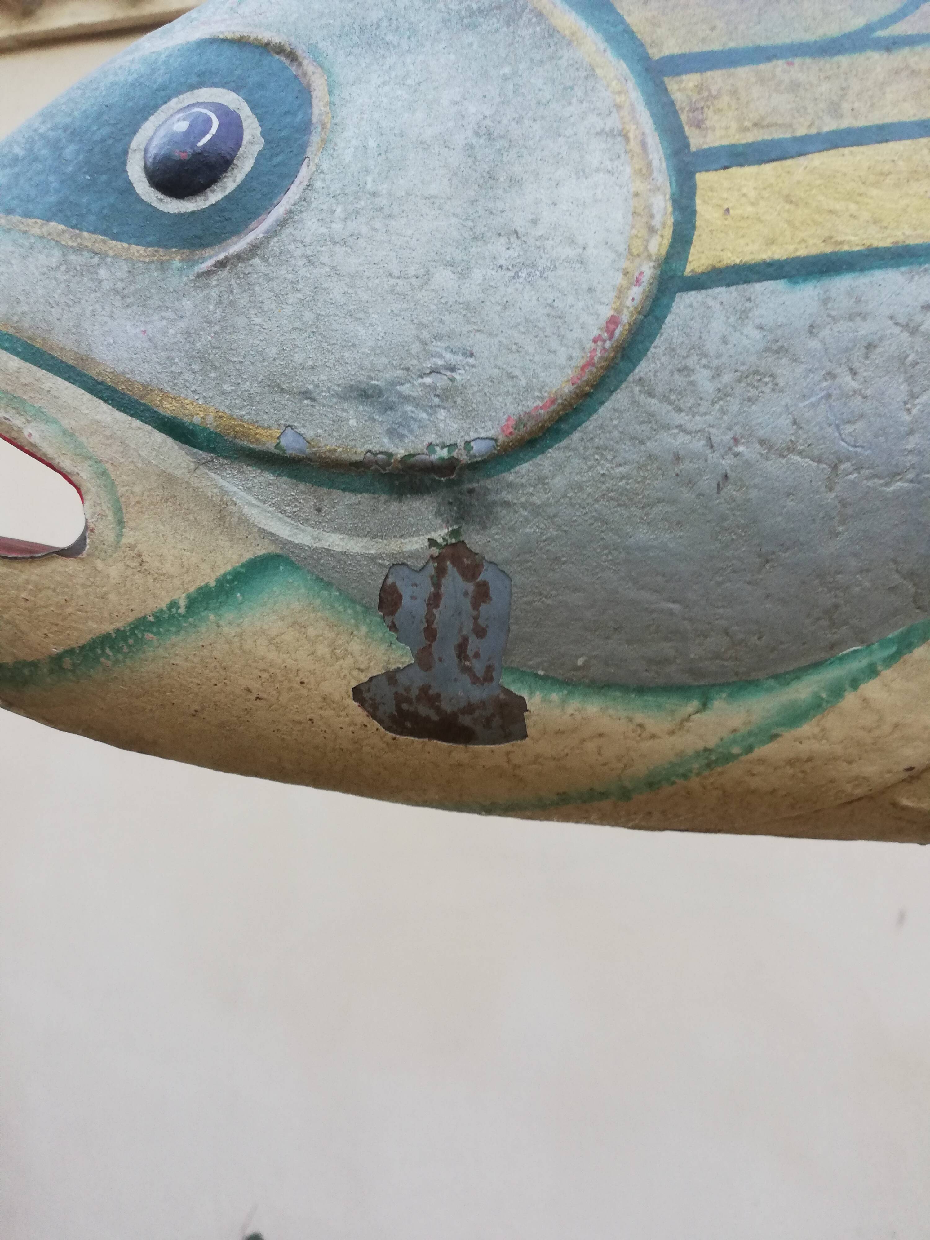 Panel depicting a fish in sheet metal