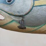 Panel depicting a fish in sheet metal