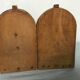 Old wooden bookends with painted characters