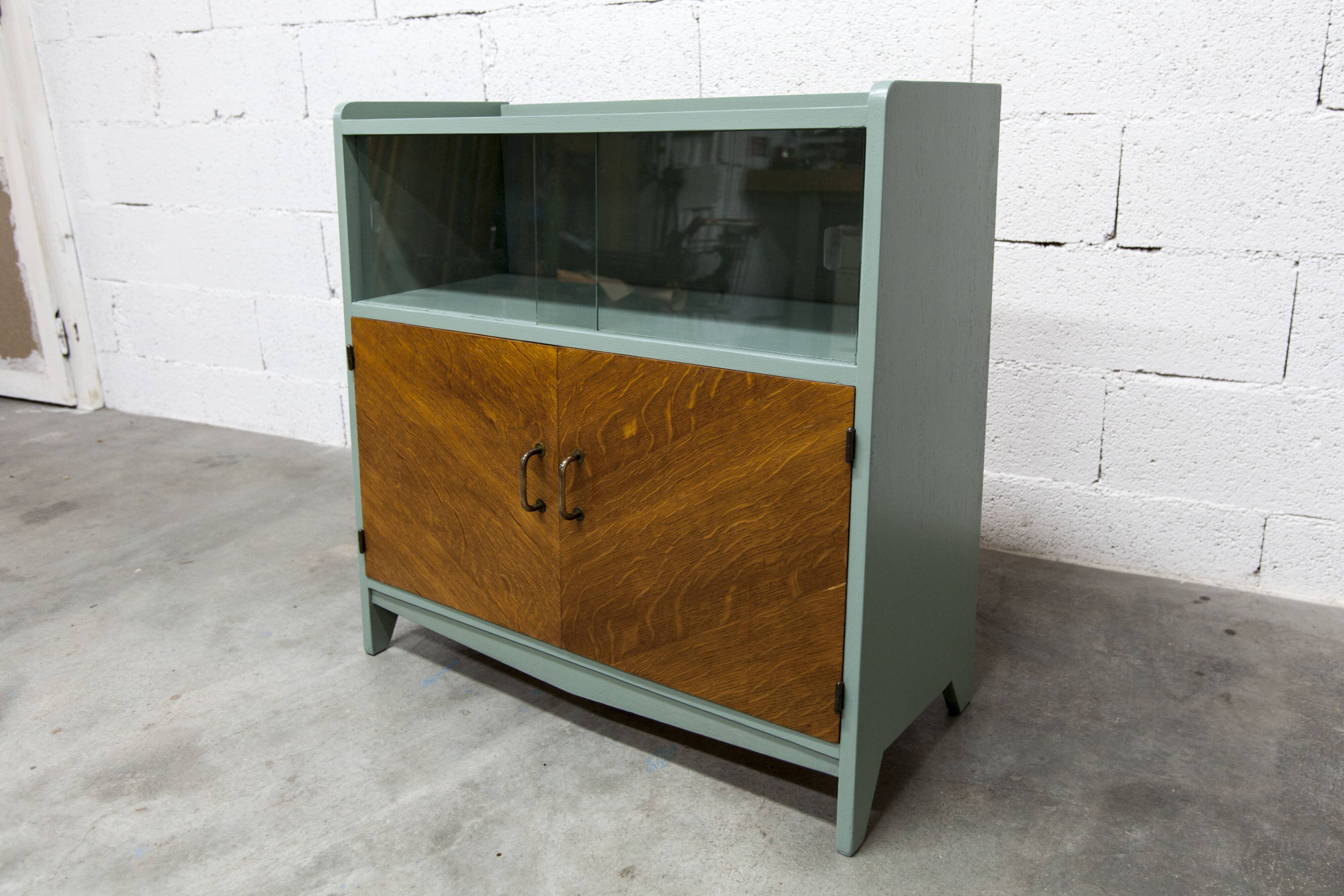 Atypical green noble 1960s low display cabinet.