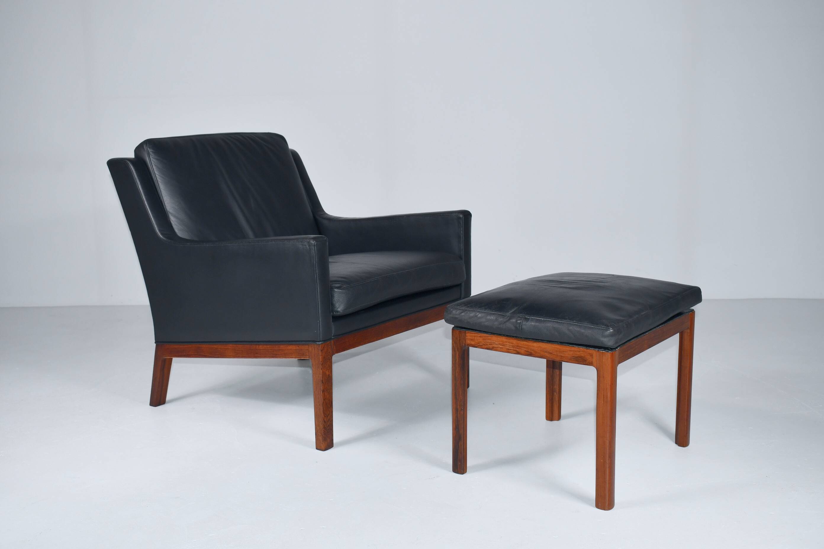 Leather armchair and footstool by Kai Lyngfeldt-Larsen. Denmark 1960s