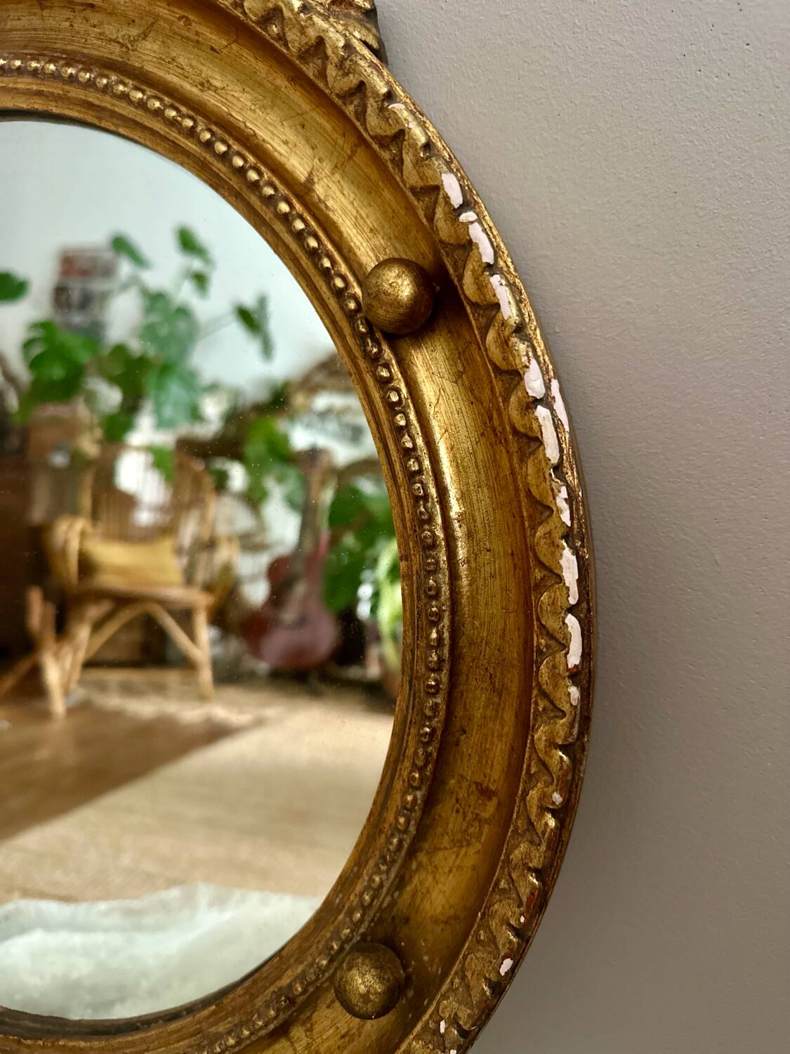 Antique gilded mirror decorated with an eagle