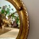 Antique gilded mirror decorated with an eagle