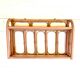 Pale pink rattan wall shelf
