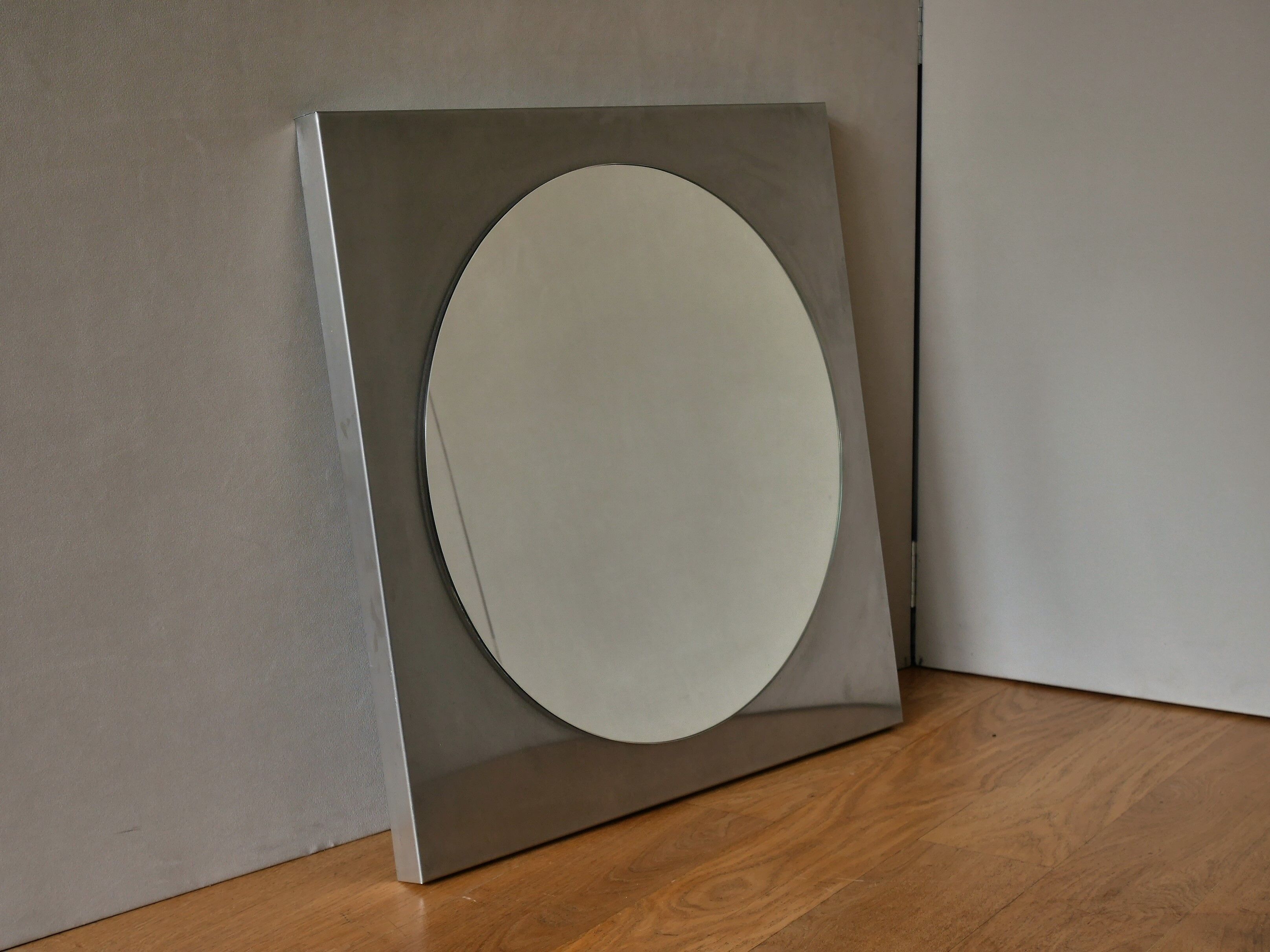 Round mirror with frame in stainless steel of the 1970s 60x60cm