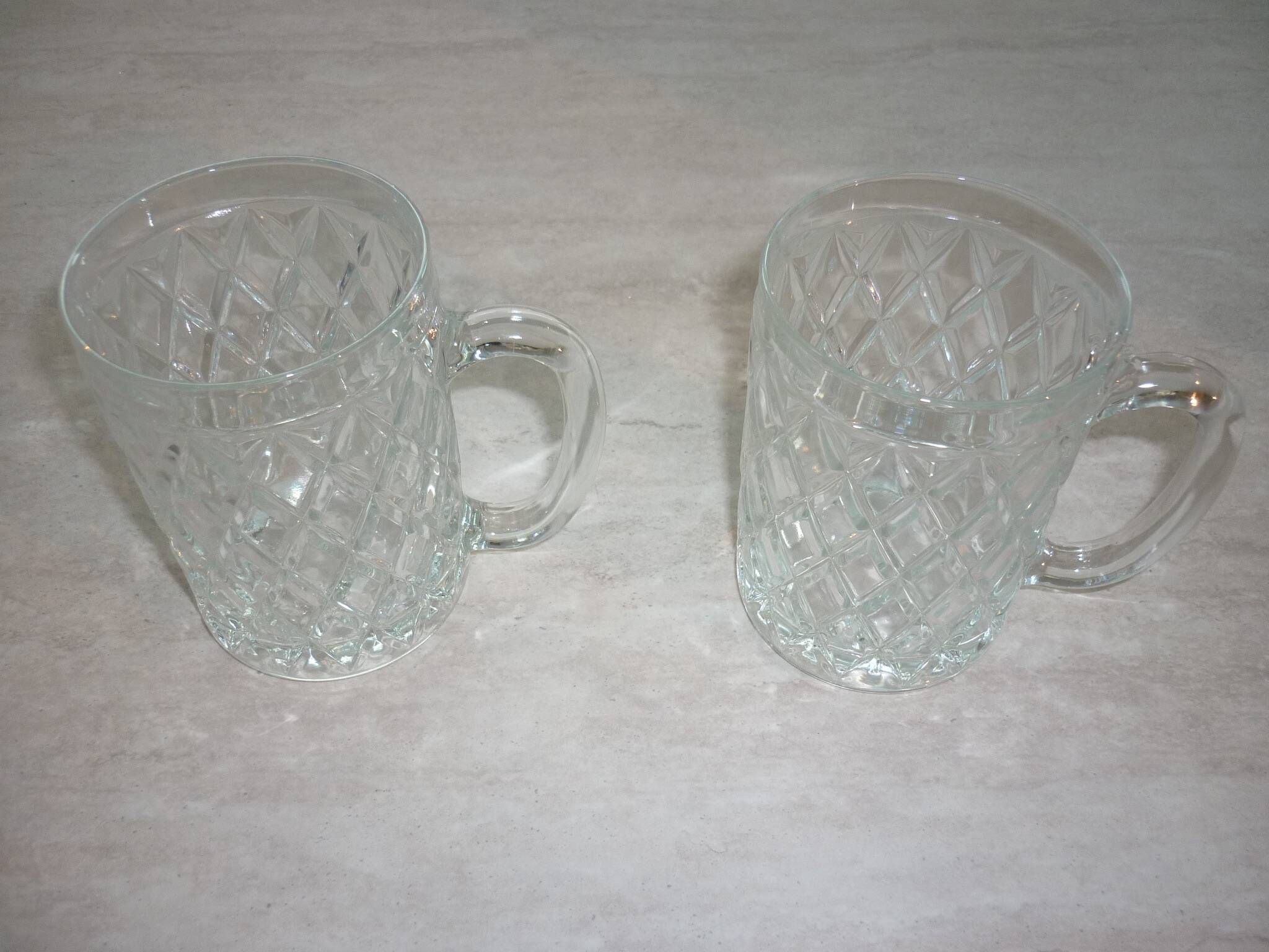 2 diamond-shaped glass beer mugs/glasses