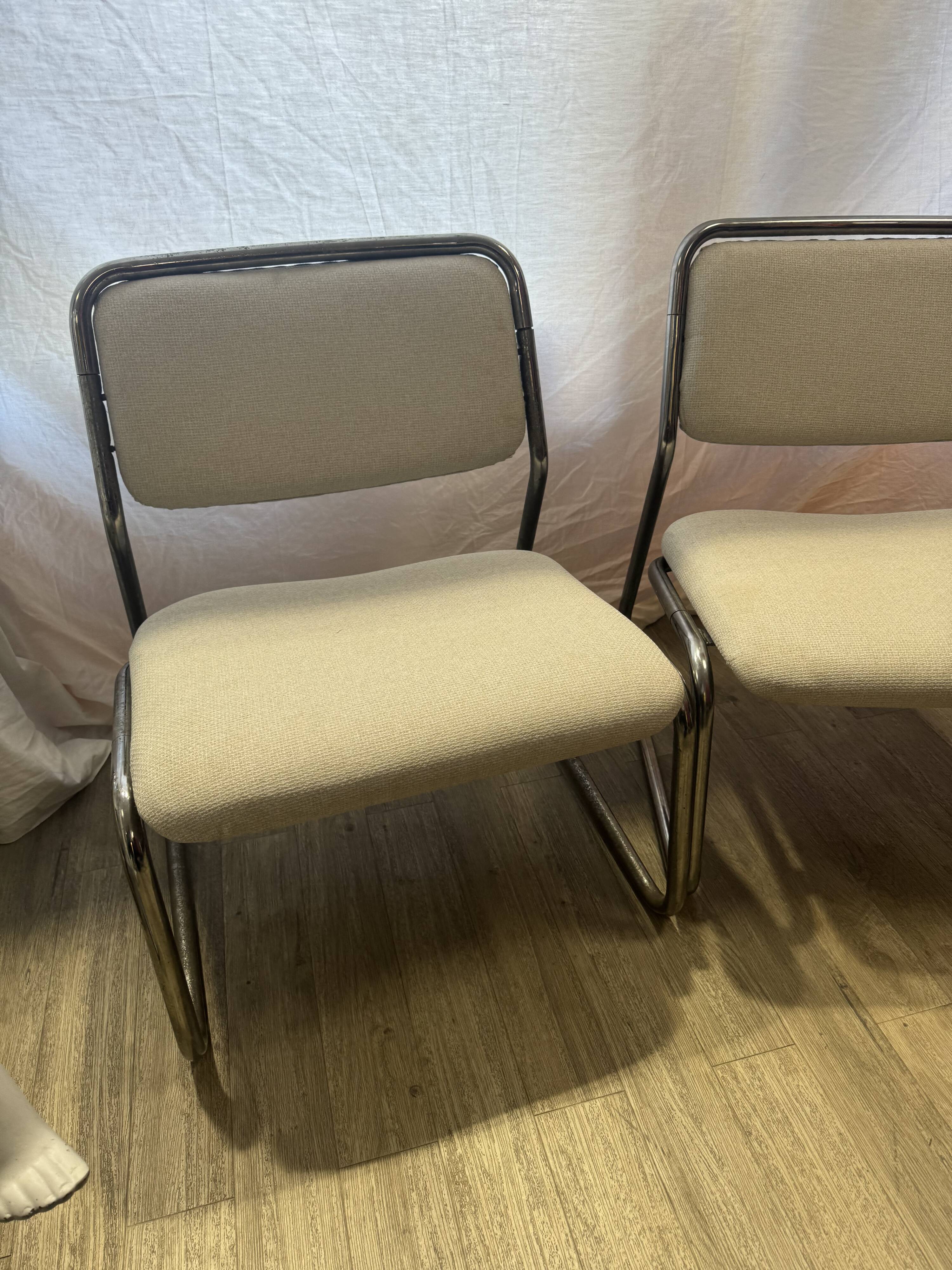 Pair of 70s tubular armchairs