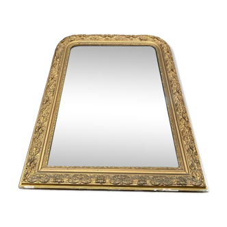Old mirror in wood and gilded stucco