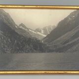 Photo in black and white mountain lake in golden frame