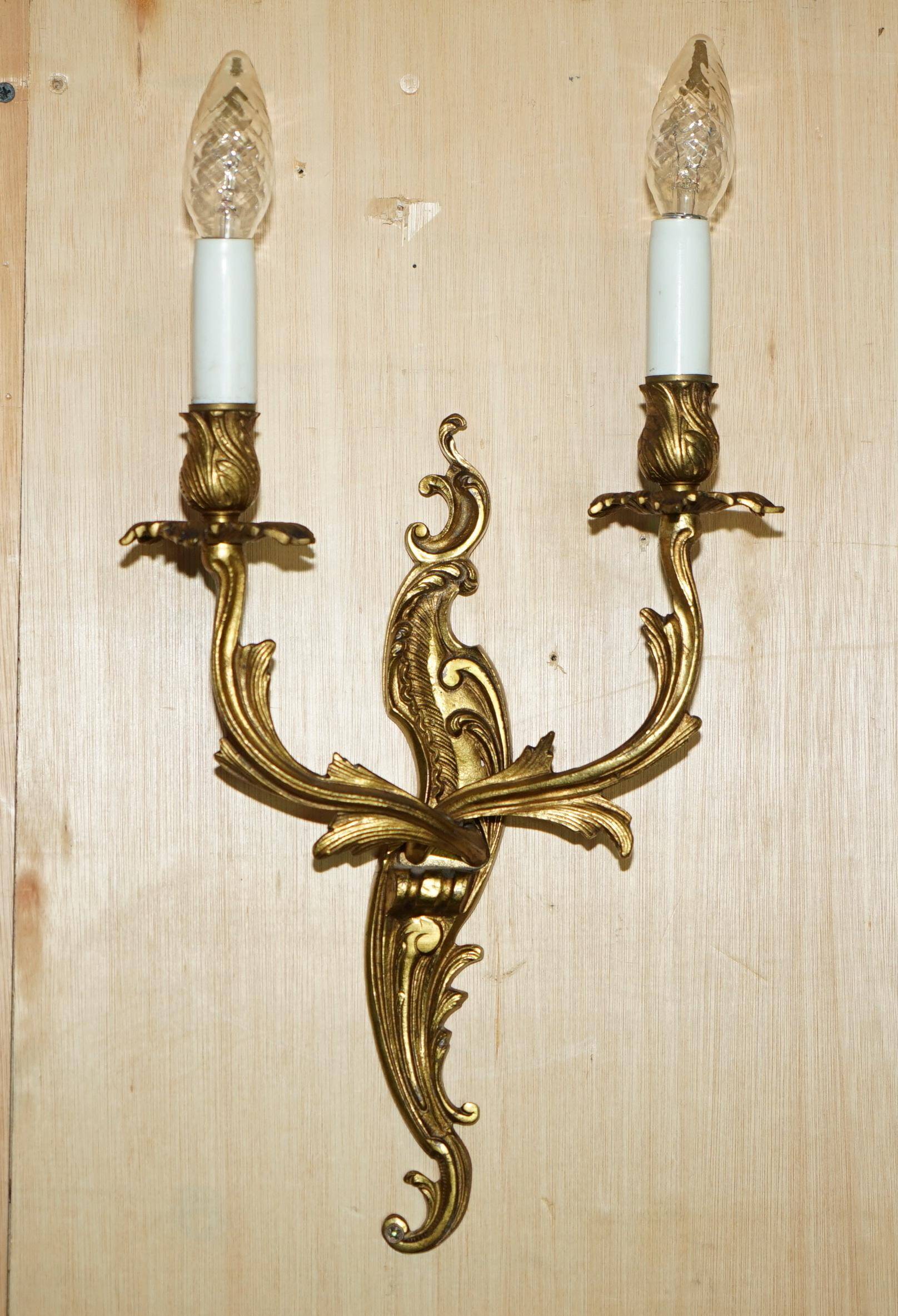 Pair of antique French wall sconces, gilded and bronzed, from the 1920s.
