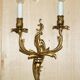 Pair of antique French wall sconces, gilded and bronzed, from the 1920s.