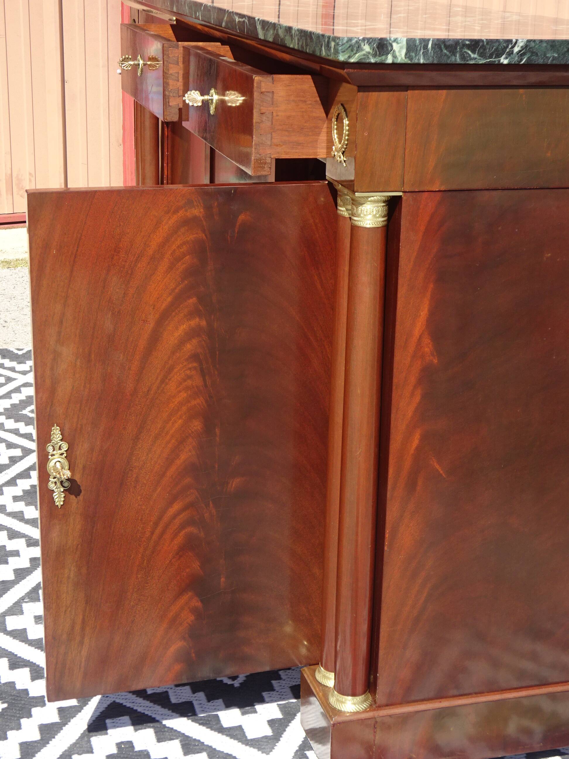 Flamed mahogany enfilade with sea green marble in Empire style.