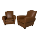 Pair of vintage club style armchairs in camel faux leather.