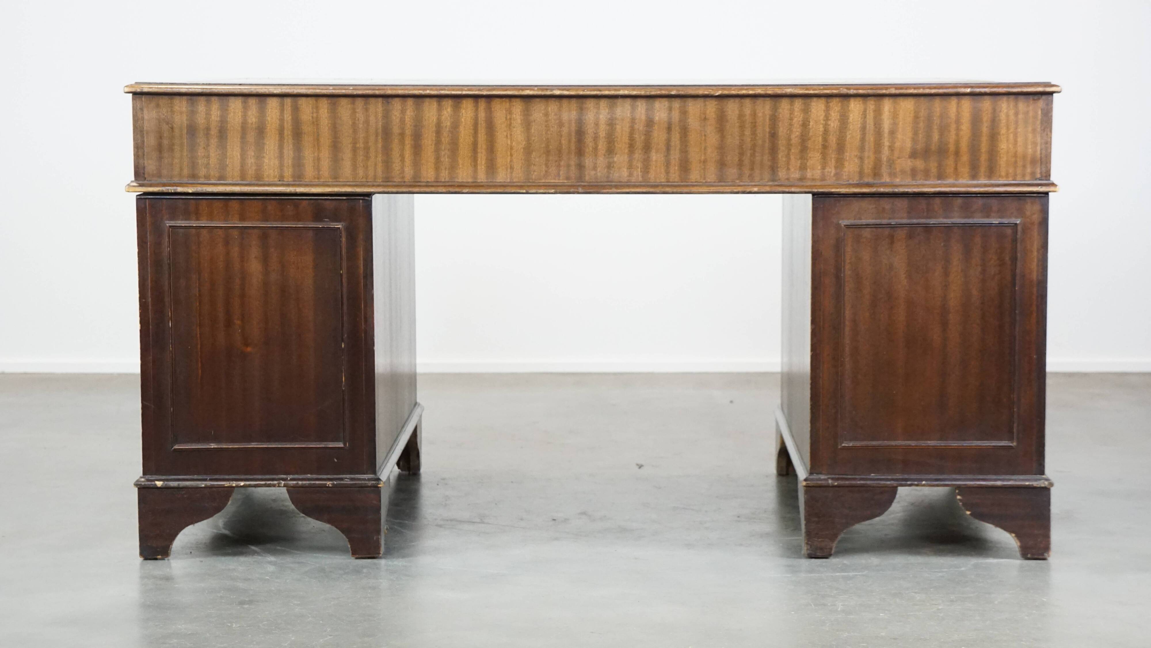 English style chesterfield desk with patina and a green leather top