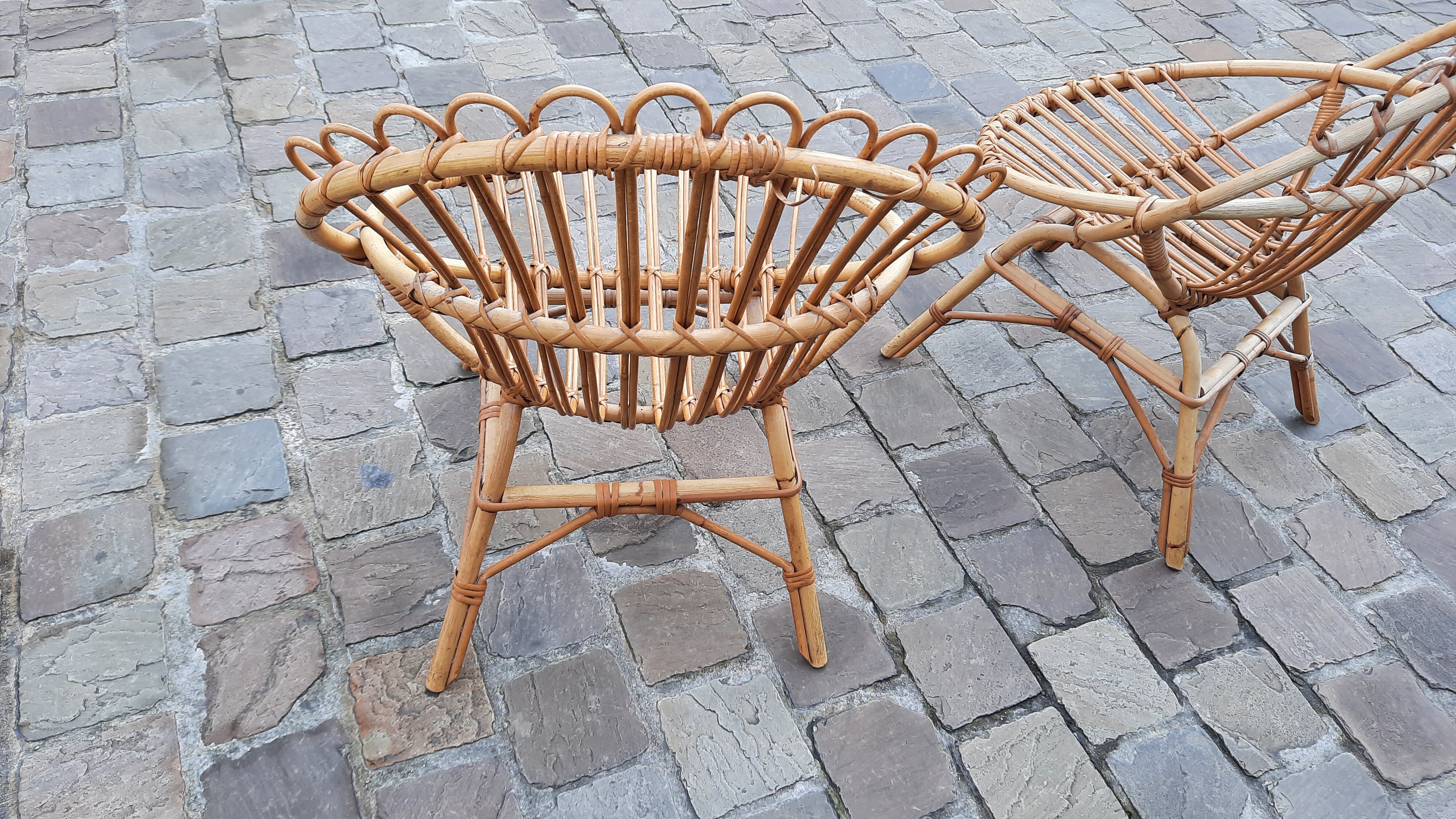 Pairs of shell rattan armchairs from the 50