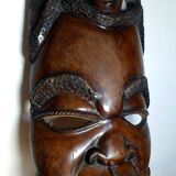 Enigmatic face of Africa carved in ebony wood