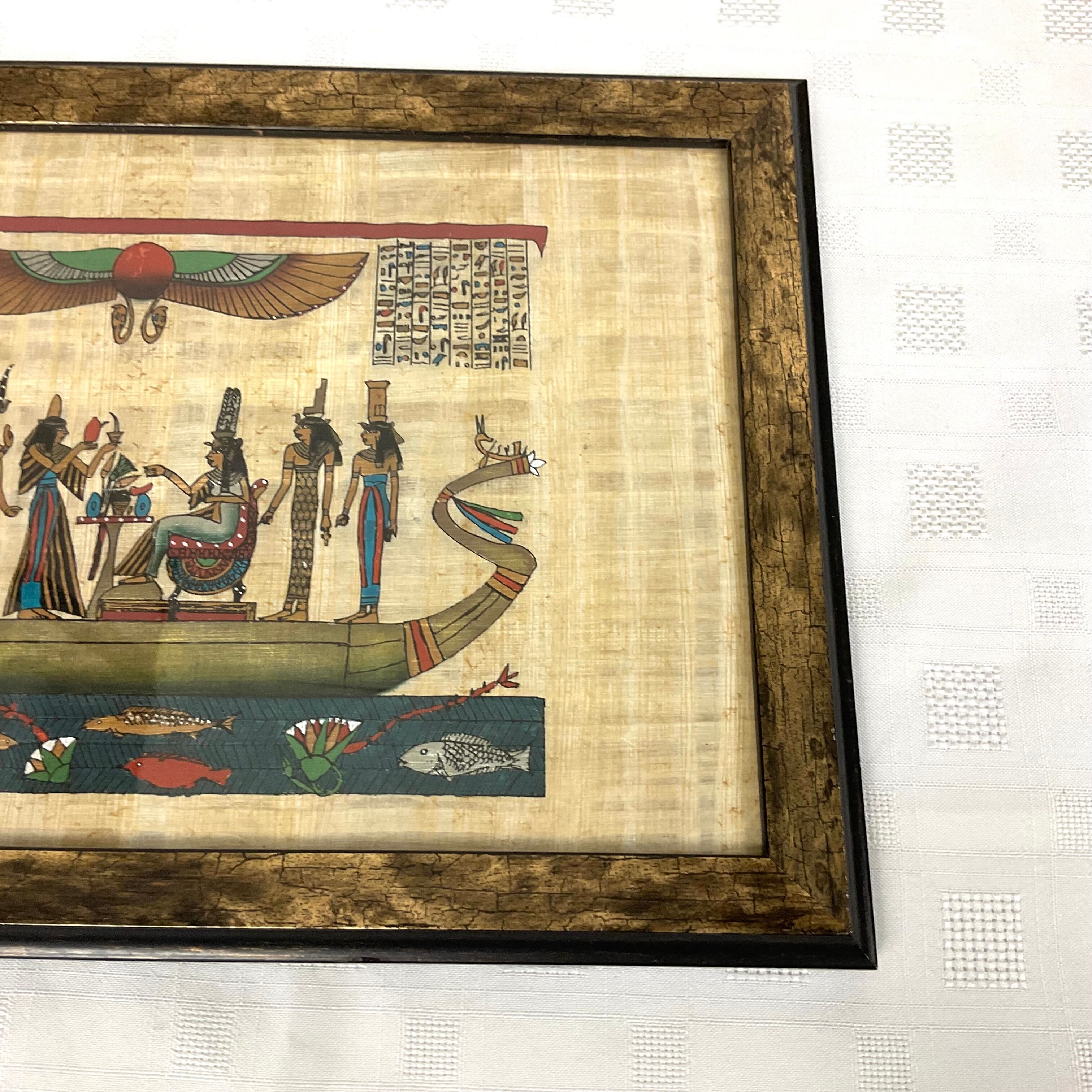 Egyptian papyrus under glass in wooden frame