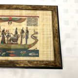 Egyptian papyrus under glass in wooden frame
