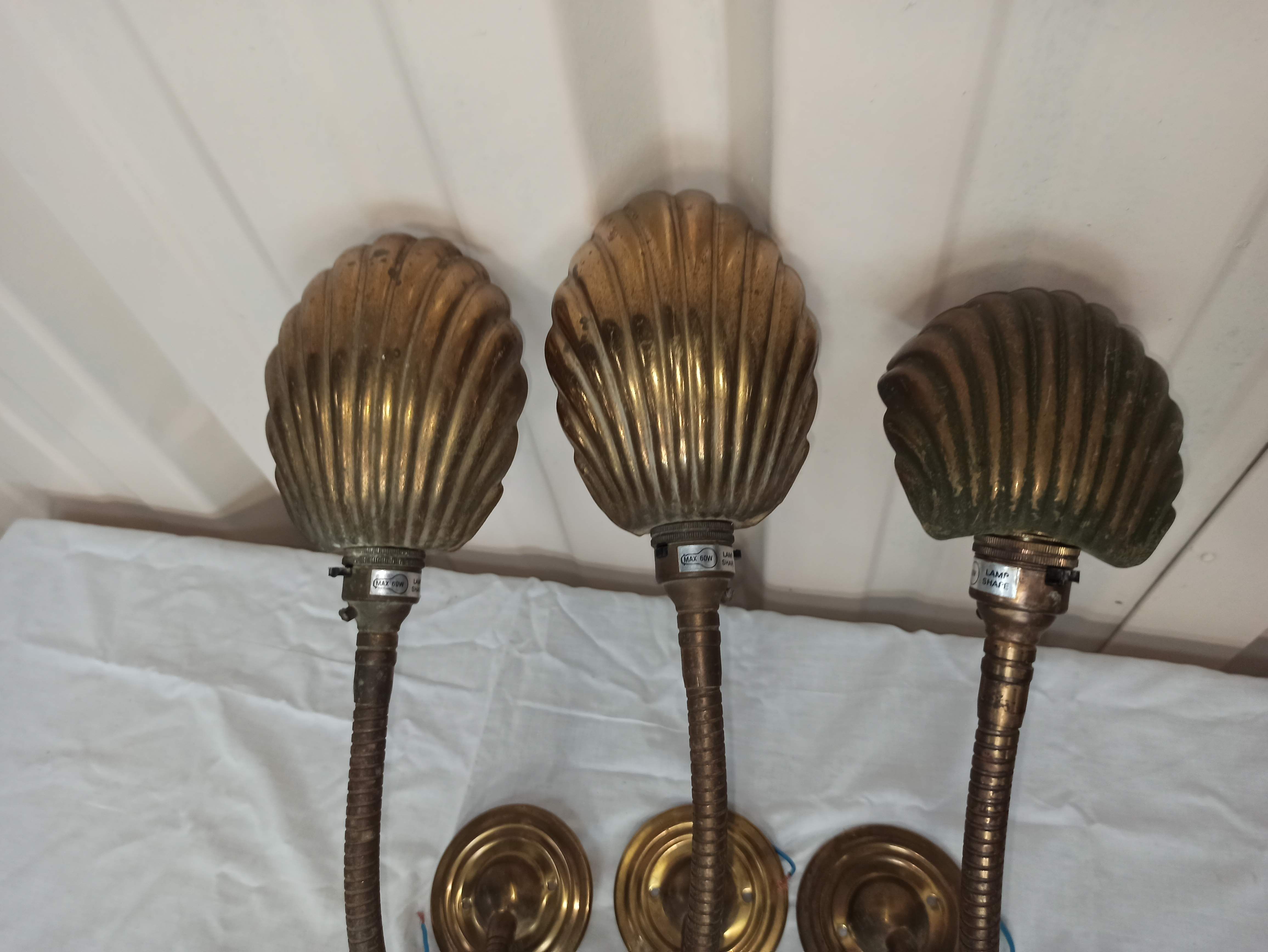 Trio of wall lamps Christopher Wray applies articulated lamp shell