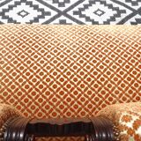 Vintage bench in wood and orange/ivory velvet.