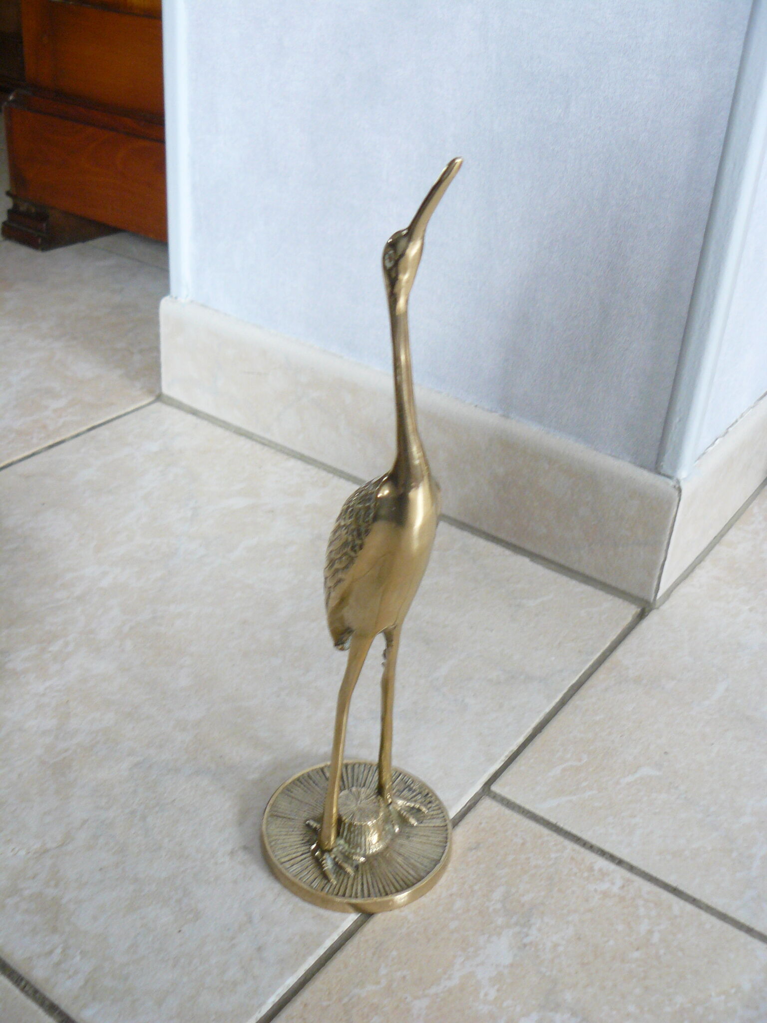 Heron in vintage brass