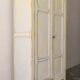 Small antique wardrobe patinated in beige and yellow.