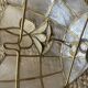 Pair of vintage wall lights in mother-of-pearl and gilded brass.