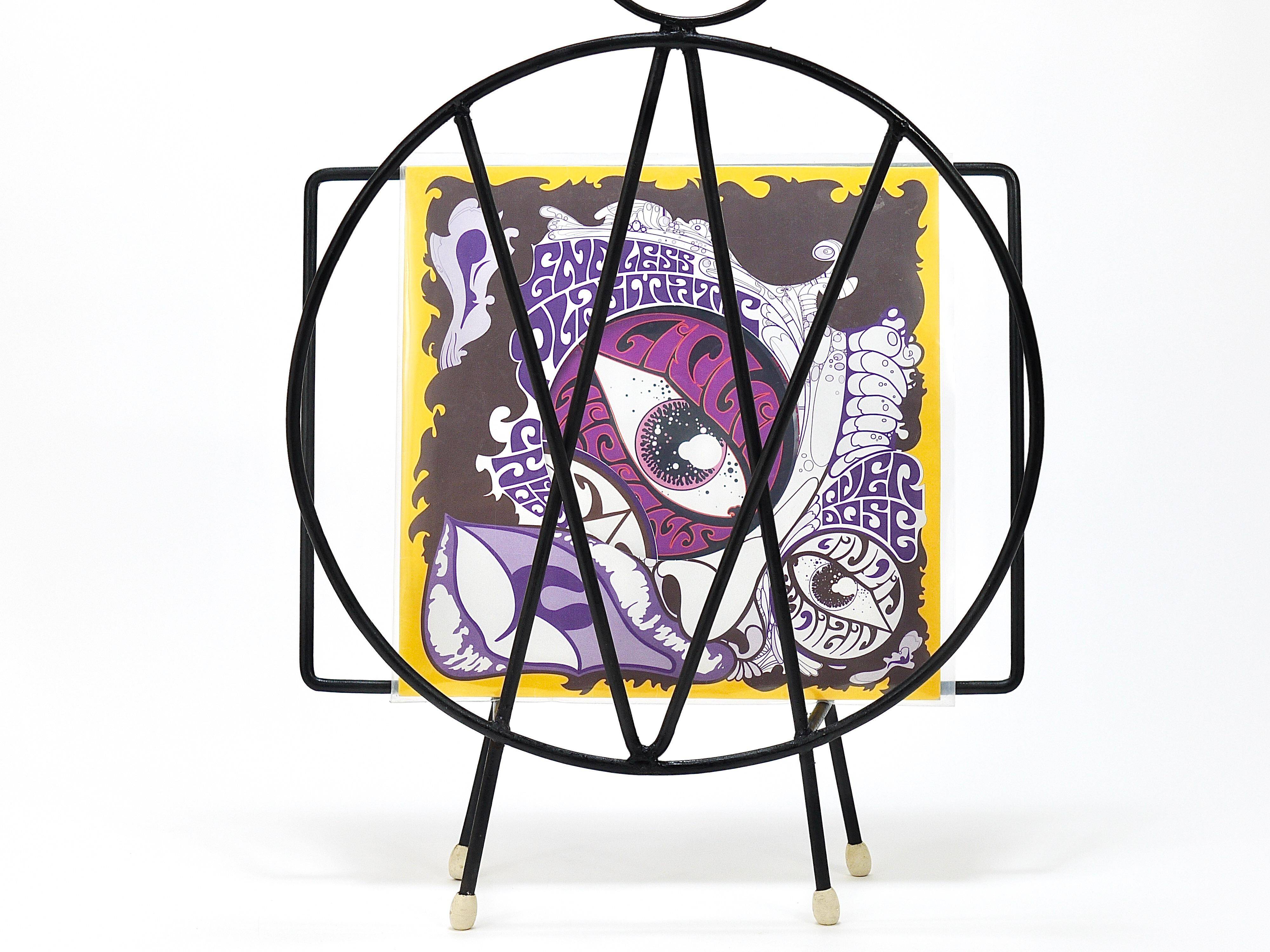 Mid-century cat-shaped magazine or record holder, iron, Italy, 1950s.