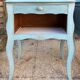 Pair of patinated lagoon blue bedside tables, early 20th century, with curved legs.