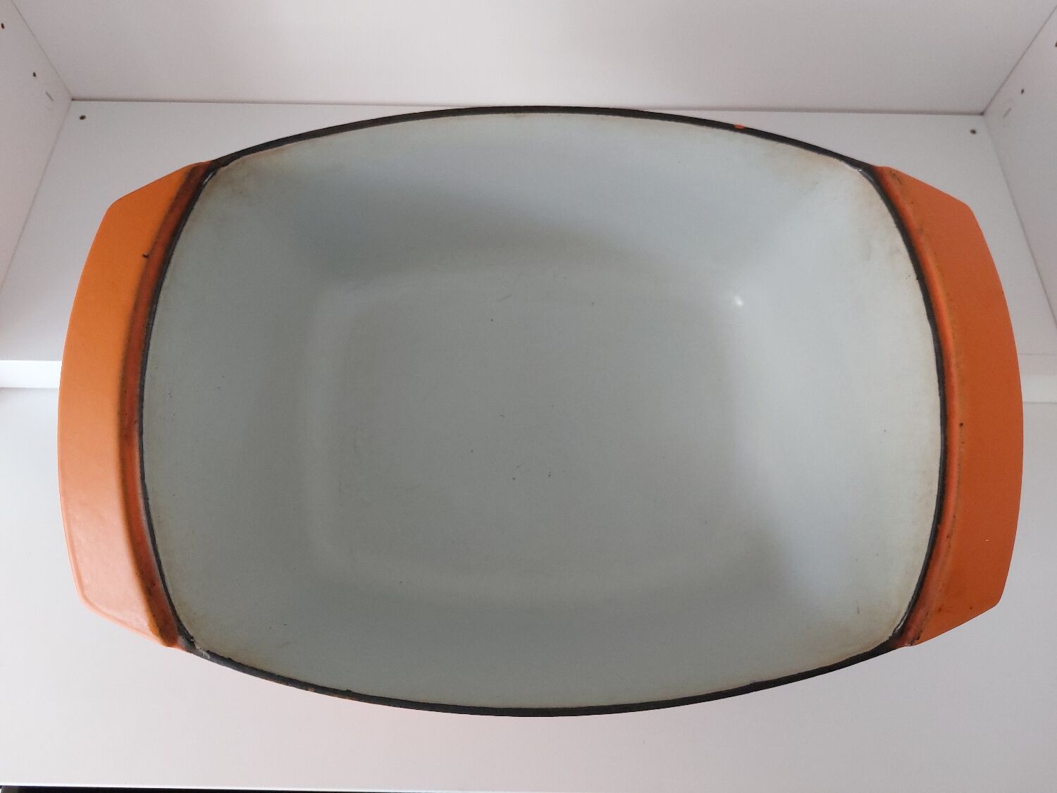 Double casserole in orange cast iron Le Creuset design Raymond Loewy