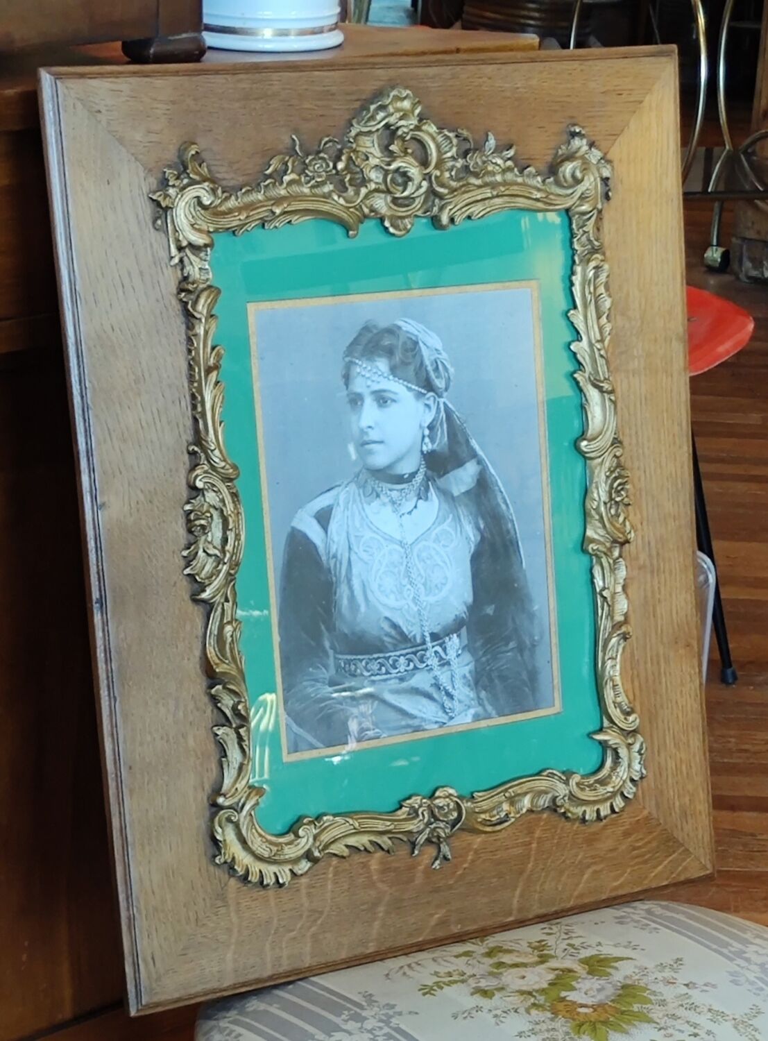 Old wooden frame and bronze ornament