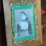 Old wooden frame and bronze ornament