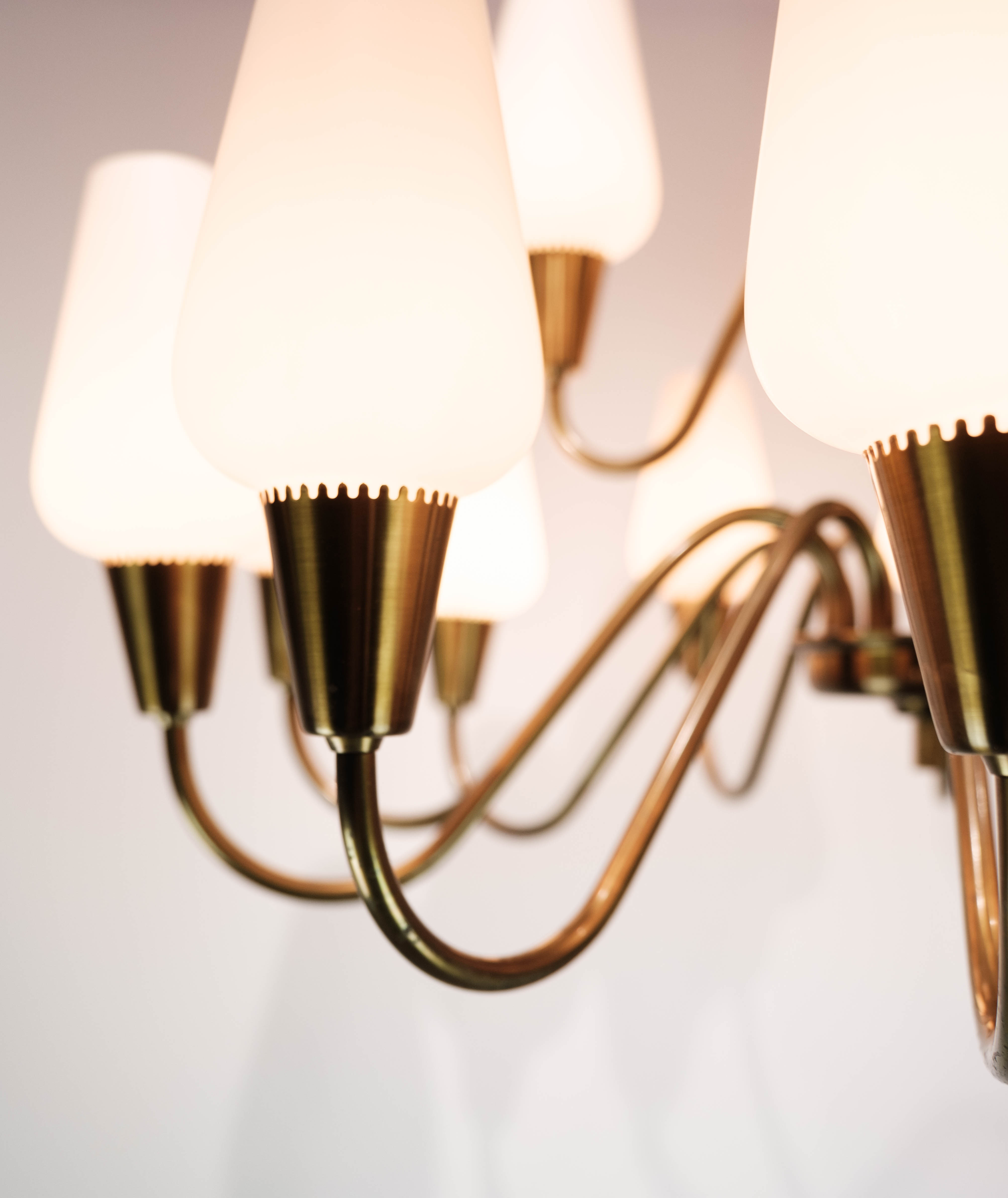 Lamp with arms of brass and glass, of Danish design from the 1950s