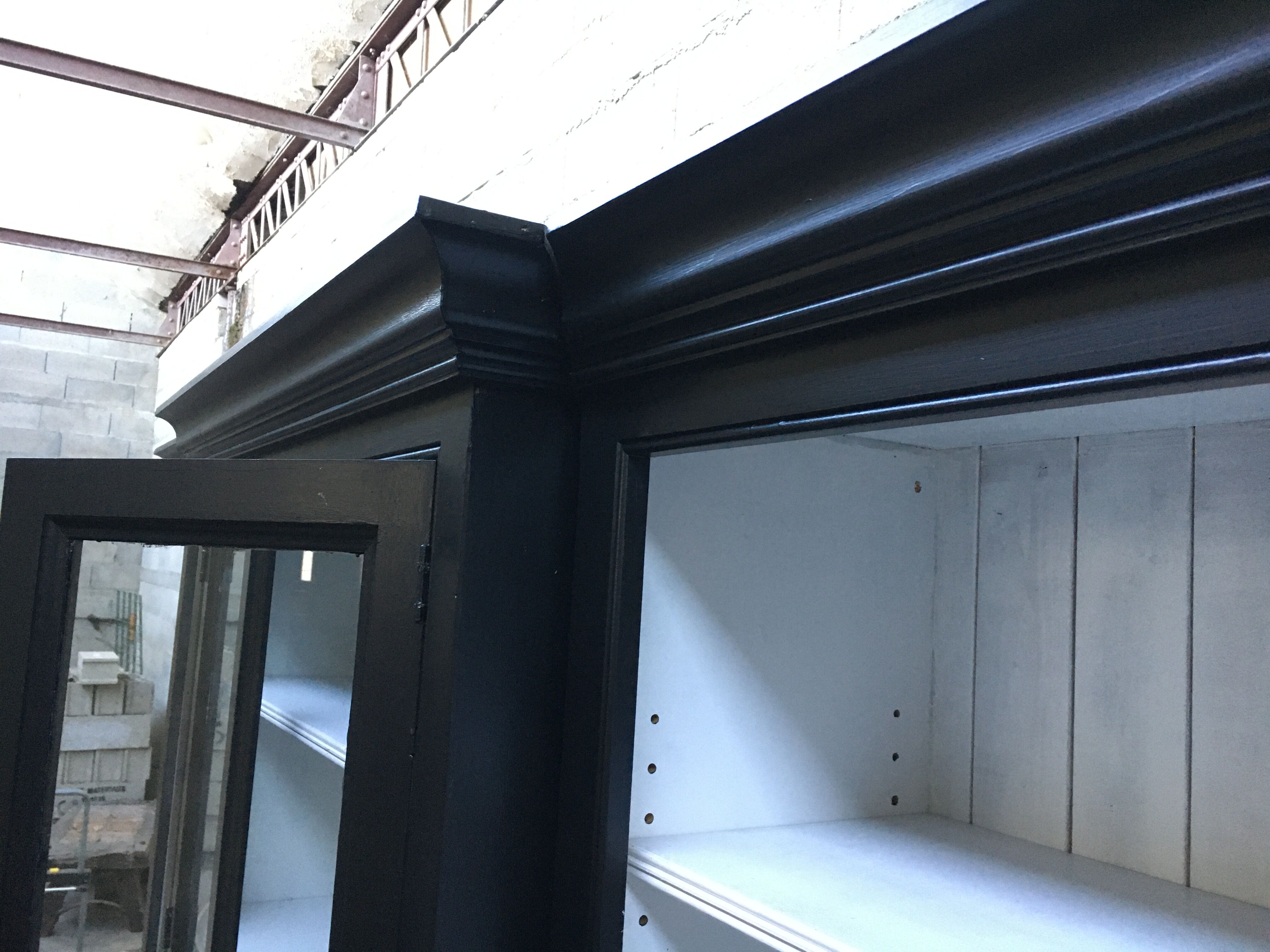 Black patinated wooden bookcase