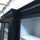 Black patinated wooden bookcase