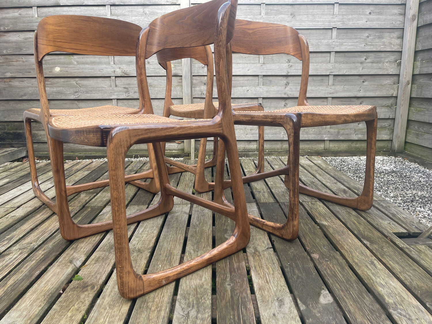4 magnificent Baumann sled chairs, with caning.