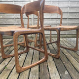 4 magnificent Baumann sled chairs, with caning.