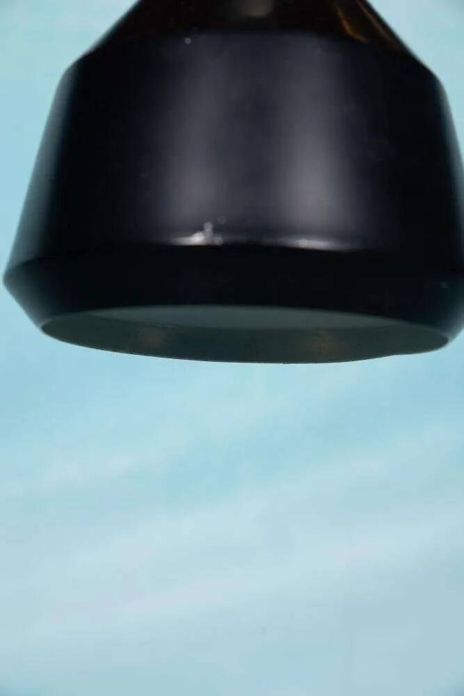 Vintage pendant light design, retro black and white ambient lamp.