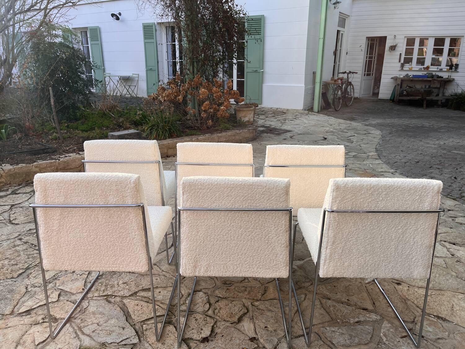 6 Paco Capdell chairs in metal and boucle fabric.