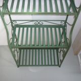 Folding green wrought iron shelf