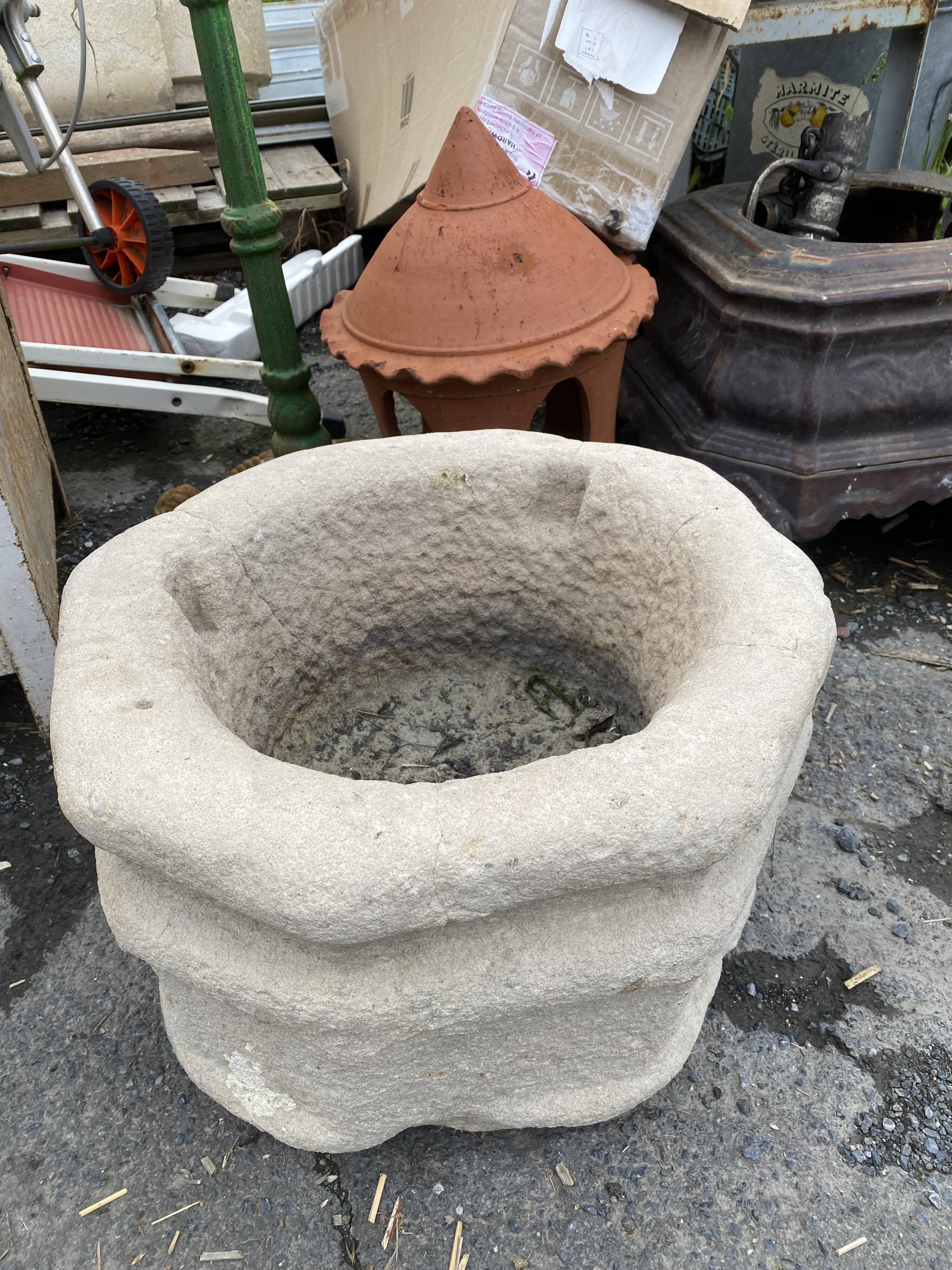 Ancient stone holy water font