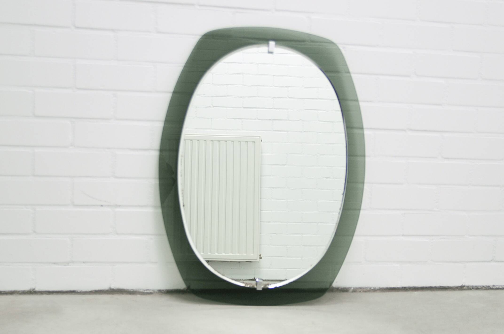Vintage space age large smoked green glass mirror by veca