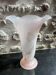 Pink glass vase decorated with tulips