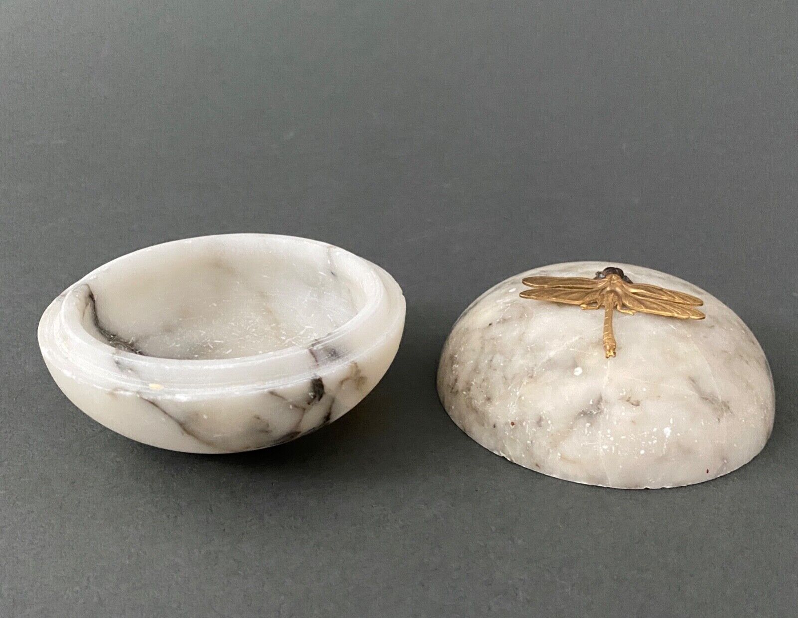 1900 alabaster ball shaped box surmounted by a golden dragonfly