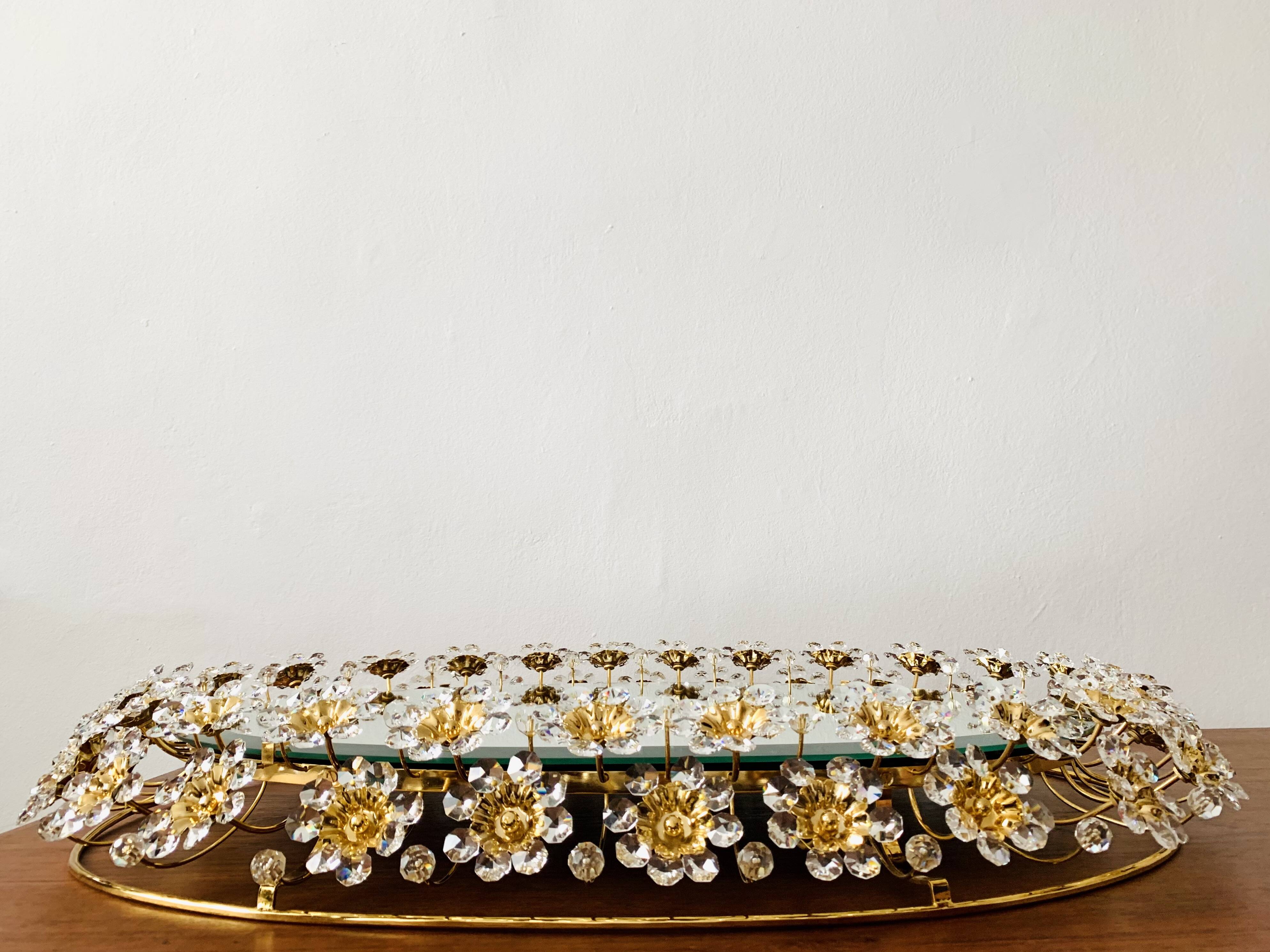 Illuminated floral mirror by Palwa