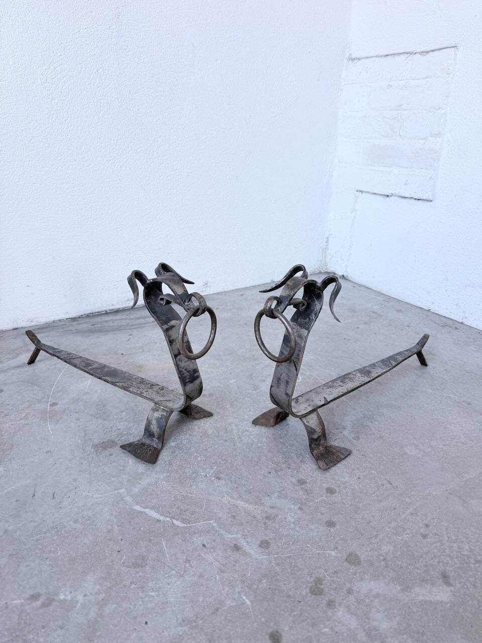 Pair of zoomorphic metal andirons "dogs" 1950