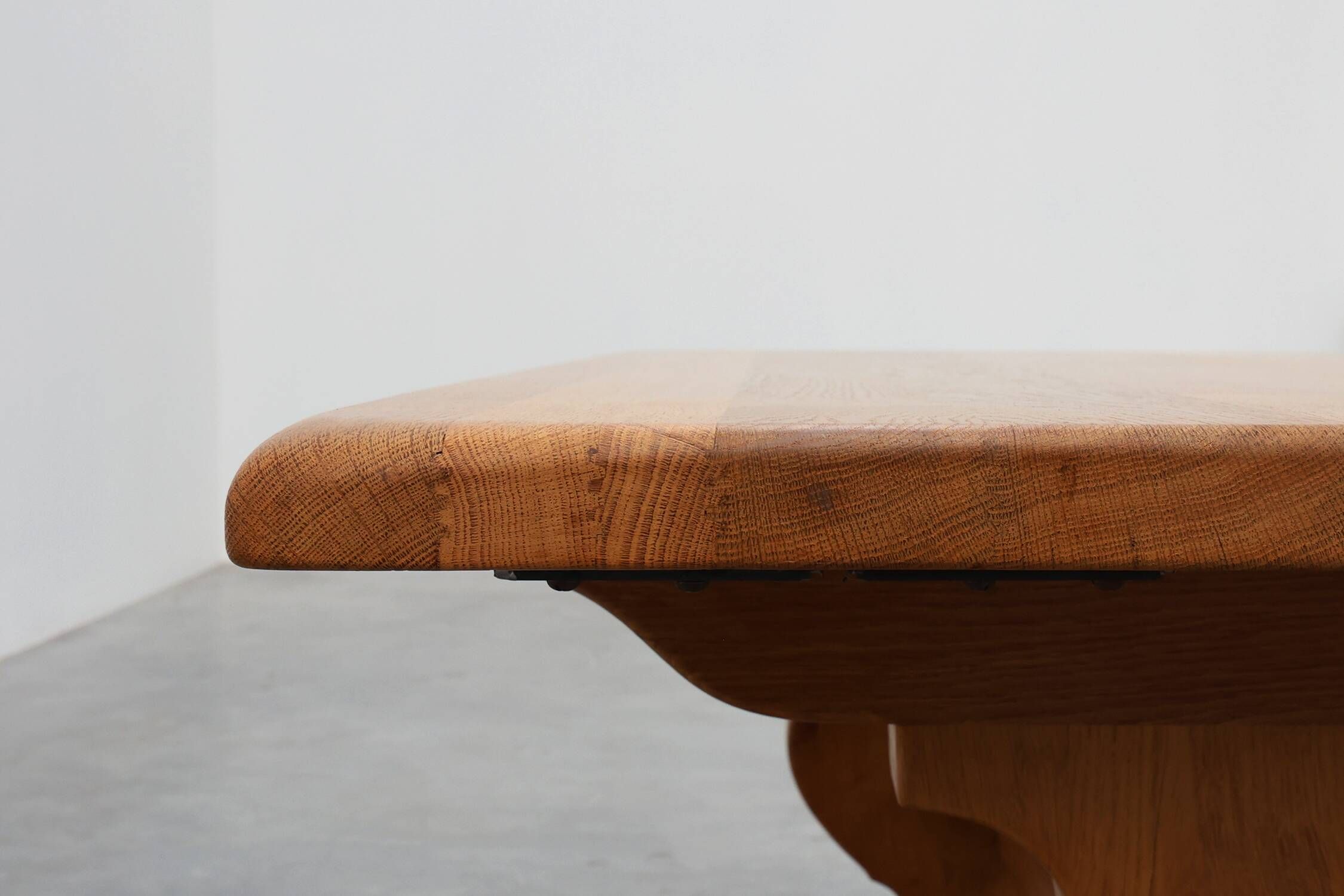 20th Century French oak trestle table with scalloped legs and plank top