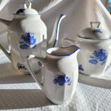 Blue and white ceramic coffee service with flowers.