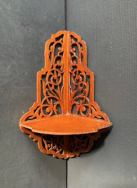 Old wall corner shelf in cut wood from the 1900s